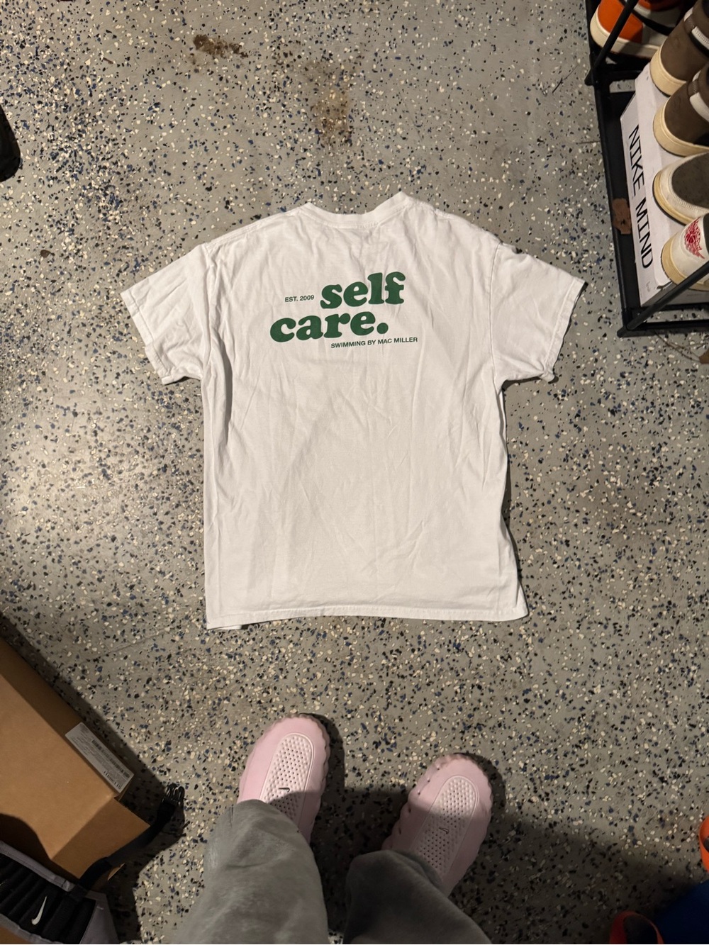White Short-Sleeve Tee with Green "self care." Back Print